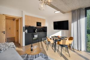 Televízia a/alebo spoločenská miestnosť v ubytovaní Panorama Lofts Pec