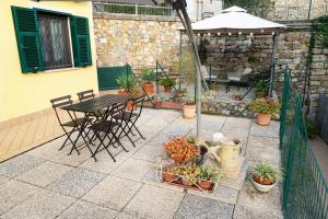 Vonkajšia záhrada v ubytovaní ULIVI - Comodità e tranquillità con Patio e Parcheggio