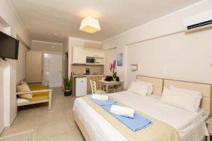 A kitchen or kitchenette at Trefon Hotel Apartments and Family Suites