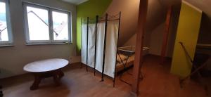 a room with a table and a window at Unterkunft im Dorf in Schwallungen +16 photos