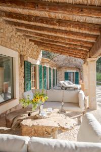 a living room with couches and a table at La Zalema in Esporles