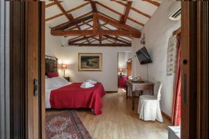A bed or beds in a room at Corte Cristina & Suites