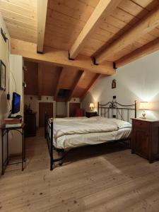 Ένα ή περισσότερα κρεβάτια σε δωμάτιο στο Val di sole Family Apartments - Aquila Reale