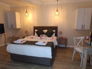 Postel nebo postele na pokoji v ubytování PRUVA İNN HoTEL