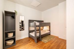 A bed or beds in a room at Homely Berlin - Central, Spacious, Rosenthaler Platz I Cafe