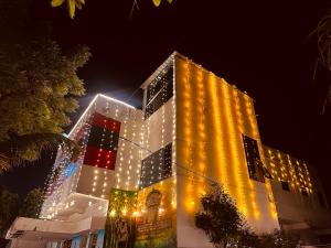 a lit up building with lights on it at night at Hotel Tathastu in Rāmtek