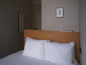 Postel nebo postele na pokoji v ubytování Hotel âme