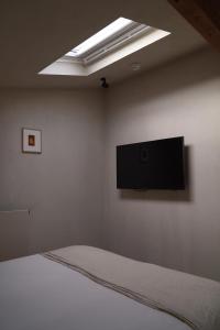 TV a/nebo společenská místnost v ubytování Hotel âme