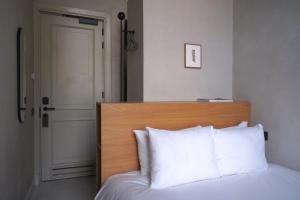 Postel nebo postele na pokoji v ubytování Hotel âme
