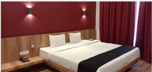 Postel nebo postele na pokoji v ubytování TGN SUITES - HOTEL