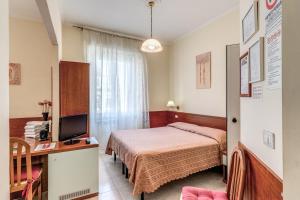 Postel nebo postele na pokoji v ubytování Hotel Katty