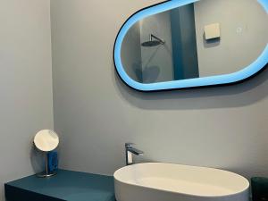 a bathroom with a sink and a mirror on the wall at La Casa Sul Pontile in Vasto