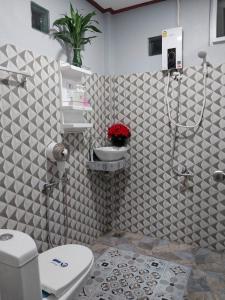 a bathroom with a toilet and a sink at Bang Yan Rimlay in Ko Yao Noi +41 photos