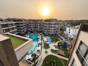 an aerial view of an apartment complex with a pool at One Bedroom Luxury Apartment at The Diamond in the City in Accra