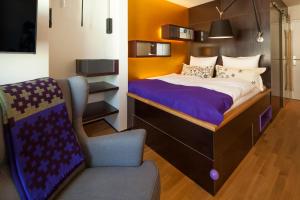 Una cama o camas en una habitación de Nala Individuellhotel
