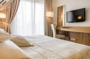 Postel nebo postele na pokoji v ubytování Hotel Zbójnicówka