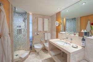 a bathroom with a sink and a toilet and a shower at Hyatt Regency Dubai - Corniche in Dubai +85 photos