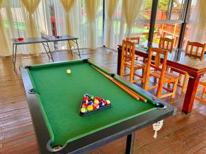 a pool table with a tray of balls on it at Tupa Hotel Iguazu in Puerto Iguazú