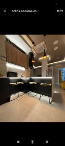 a kitchen with tables and chairs in a room at Apartamento ideal en calle florista in Valencia