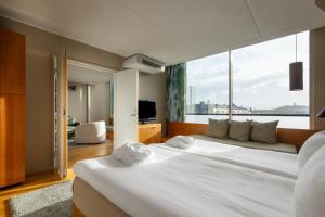 A bed or beds in a room at Hyatt Place Gothenburg Central