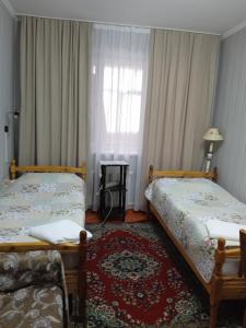 Postel nebo postele na pokoji v ubytování Baktygul guesthouse