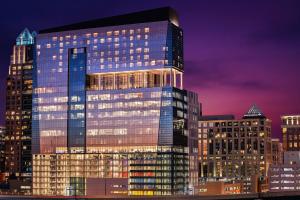 a tall building with many windows at night at AC Hotel by Marriott Orlando Downtown in Orlando