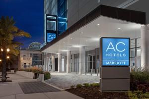 a building with aac hotels sign in front of it at AC Hotel by Marriott Orlando Downtown in Orlando