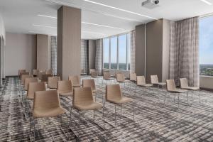 a waiting room with chairs and windows at AC Hotel by Marriott Orlando Downtown in Orlando