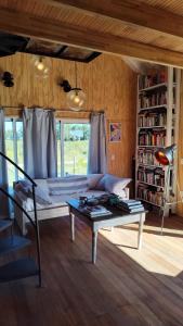 a living room with a couch and a coffee table at La casa Donna in Sauce de Portezuelo