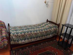 Postel nebo postele na pokoji v ubytování Baktygul guesthouse