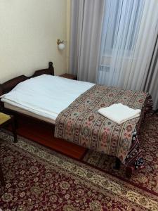 Postel nebo postele na pokoji v ubytování Baktygul guesthouse