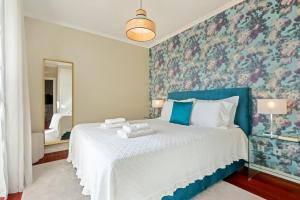 Postel nebo postele na pokoji v ubytování Exquisite Ocean Apartment by Homie