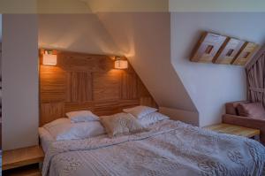 Postel nebo postele na pokoji v ubytování Hotel Zbójnicówka