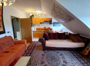 a living room with a couch and a kitchen at Welcome Home in Bochum