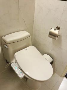 Baðherbergi á 新仕飯店-New City Hotel