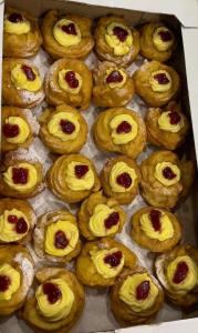 a box full of pastries with jam on them at Casa Vacanze Rosarlo in Nettuno