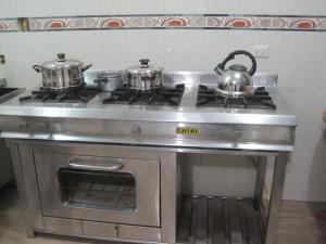 Kuchyň nebo kuchyňský kout v ubytování Wasi Airport Apartment
