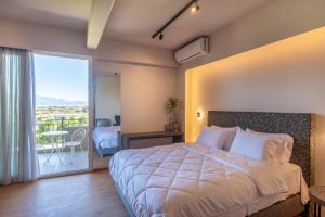 Postelja oz. postelje v sobi nastanitve KOSMAPOLITAN hotel