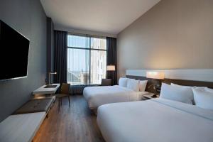 Postel nebo postele na pokoji v ubytování AC Hotel by Marriott Fort Worth Downtown