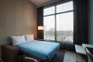 Postel nebo postele na pokoji v ubytování AC Hotel by Marriott Fort Worth Downtown