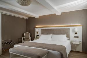 Postel nebo postele na pokoji v ubytování Hotel Montecarlo
