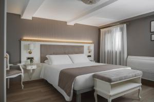 Postel nebo postele na pokoji v ubytování Hotel Montecarlo