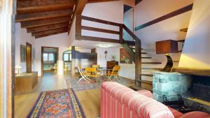 a living room with a couch and a table at Ste 10 in Celerina