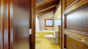 a bathroom with a toilet and a sink at Ste 10 in Celerina +27 photos