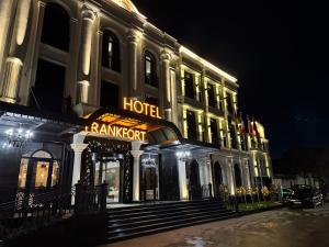 a hotel is lit up at night at FRANKFORT Expo Hotel in Tashkent