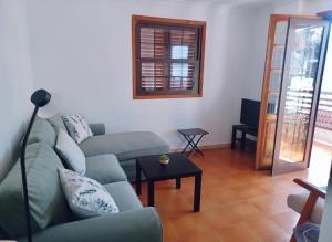 a living room with a couch and a table at Vv La Marina in Santa Cruz de la Palma