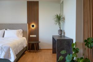 Postelja oz. postelje v sobi nastanitve KOSMAPOLITAN hotel