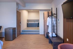 Postelja oz. postelje v sobi nastanitve KOSMAPOLITAN hotel