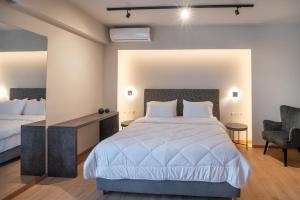 Postelja oz. postelje v sobi nastanitve KOSMAPOLITAN hotel