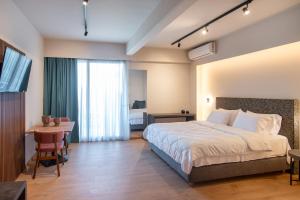 Postelja oz. postelje v sobi nastanitve KOSMAPOLITAN hotel